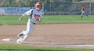 Lovell Mustang Cole Wambeke races around third base to score the run that ended the Lovell-Powell game on the 10-run rule Thursday evening, a 19-9 victory for the Mustangs, their sixth win of the season against Powell. David Peck photo 
