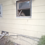 Longtime area educator and wrestling coach Daniel Robertson pulled Merrianne Hall through this window to safety after a house fire ignited Sunday around 2:30 a.m. David Peck