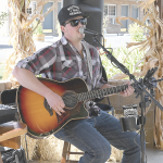 Kasen Banks sings at the Horseshoe Bend Motel during the Fall Festival Saturday. Nice weather produced a strong turnout for the event. David Peck