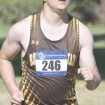 Rocky Mountain High School junior Ethan Haslem shows a look of intense determination during Friday’s cross country meet in Powell. Haslem placed 67th with a time of 22:34. David Peck