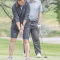 Tashie Lundberg putts on the third hole green as Dave Beemer looks on during the Lovell’s Days Golf Tournament. The Lundberg team captured the title in the gross scoring division. David Peck
