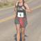 April Nicholls cruises along Lane 13 east of the Foster Gulch Golf Course during the Lovell Rec District Sugar Beet Run Saturday morning. Nicholls placed a strong second in the half marathon in a time of 1:58.33. David Peck