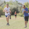 Lovell cross country coach Caleb Sanders offers some much-needed encouragement as Isaac Sanders tackles a difficult hill during the Lander cross country meet last Thursday. Michelle Hoyt