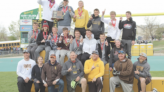 Retiring Rocky Mountain High School track coach Tobee Christiansen (third from right) celebrates with his team moments after clinching the first and only state track championship in school history in 2021. Courtesy Photo