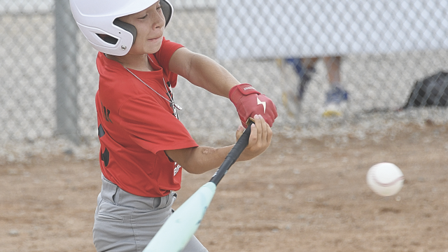 Cayden Dickerson takes a mighty cut at a pitch during the All Stars and Stripes Tournament in late July in Lovell. Dickerson and his teammates will compete at the Wyoming Little League State Tournament in Torrington July 23-26. David Peck