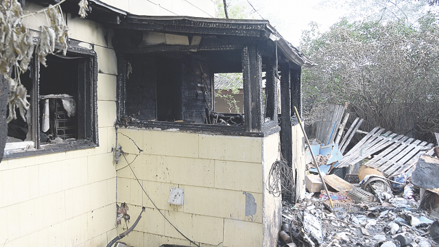 Fire in this part of the Merrianne Hall home at 827 Shoshone in Lovell prevented Merrianne Hall from exiting her house when fire broke out early Sunday morning. Sherry Snell